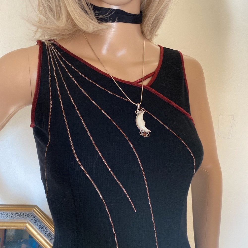 Vintage black midi dress with an interesting pattern on the bust